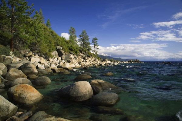 CA, Lake Tahoe Granite boulders line a lake